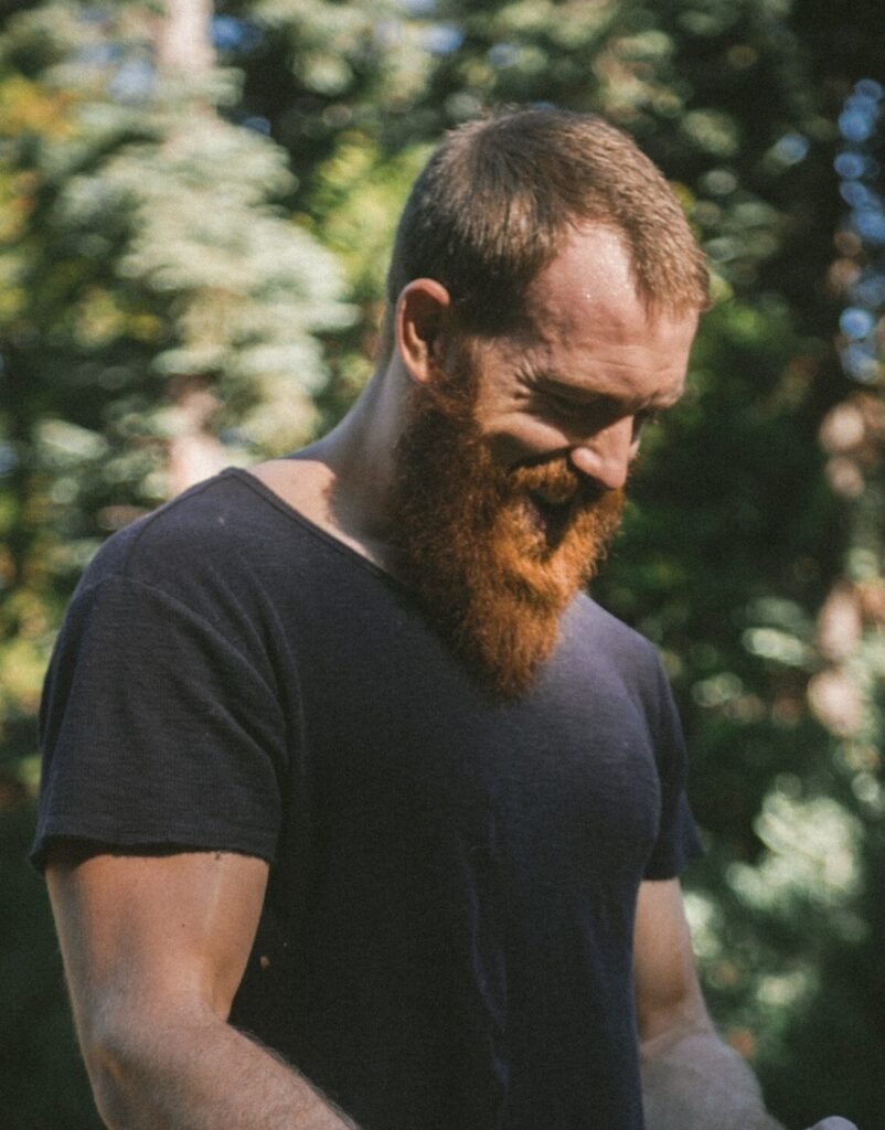 Logger in a forest, teaches survival skills.